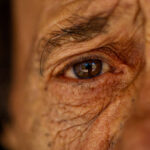 Close up view of a brown eye of a senior man